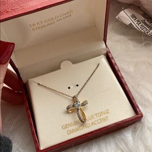 Blue topaz and gold cross
